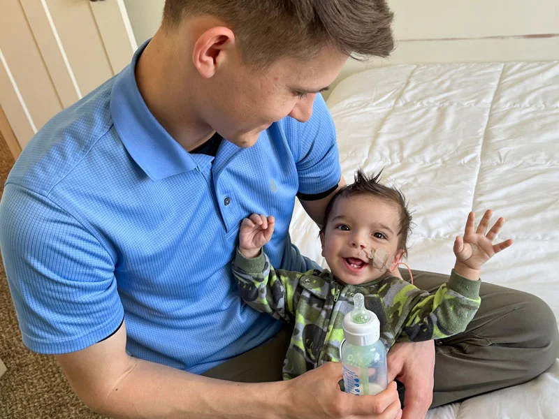 Baby Cyrus being bottle fed