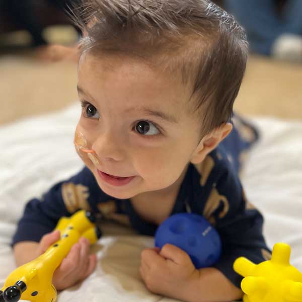 Photograph of Baby Cyrus with his toys
