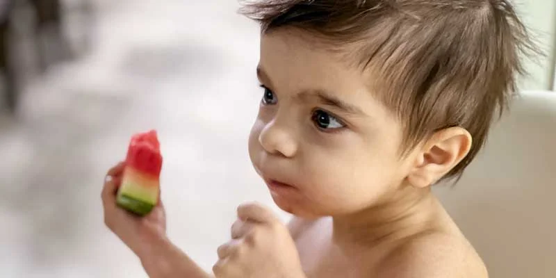 Baby Cyrus eating water melon