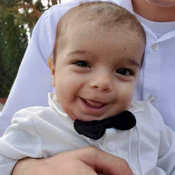 Photograph of Baby Cyrus dressed smartly