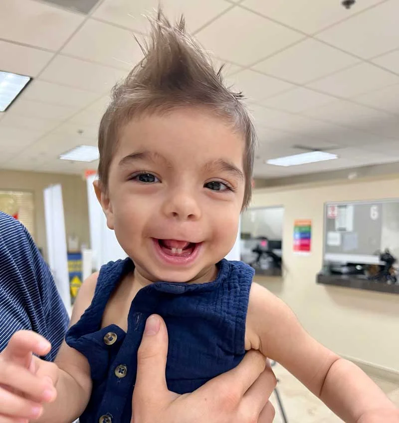 Baby Cyrus happy and smiling